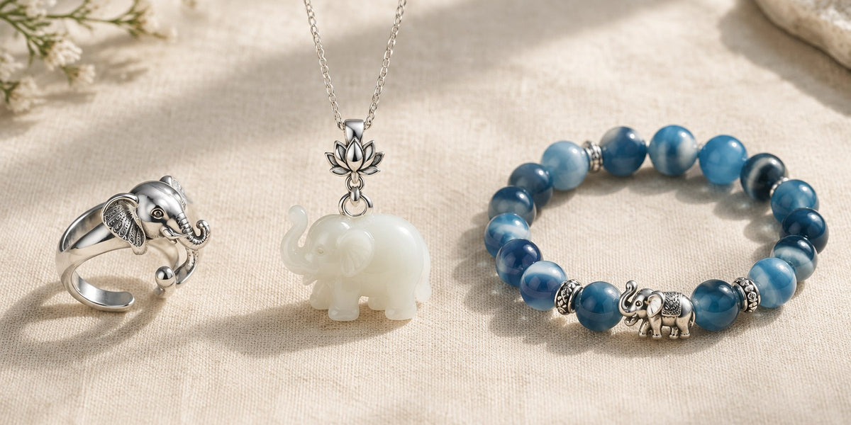 Silver elephant ring, white jade elephant pendant and blue agate elephant bracelet on linen