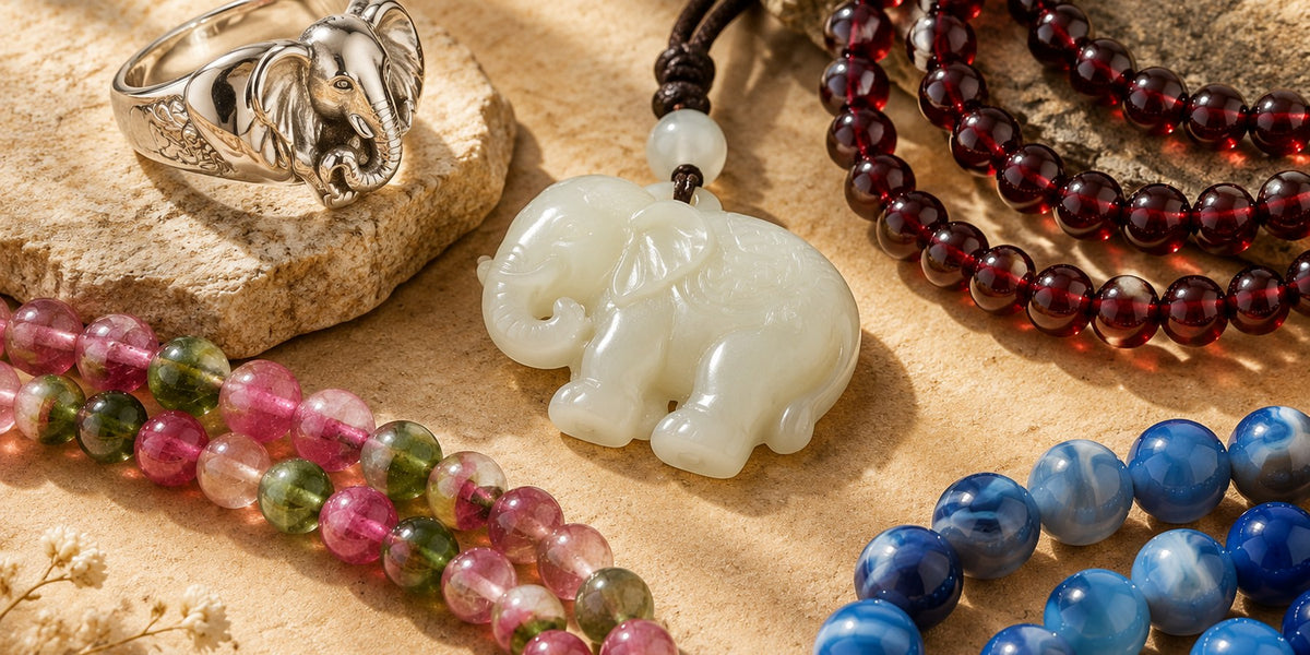 Silver elephant ring, carved white jade pendant, garnet and tourmaline beads arranged by material