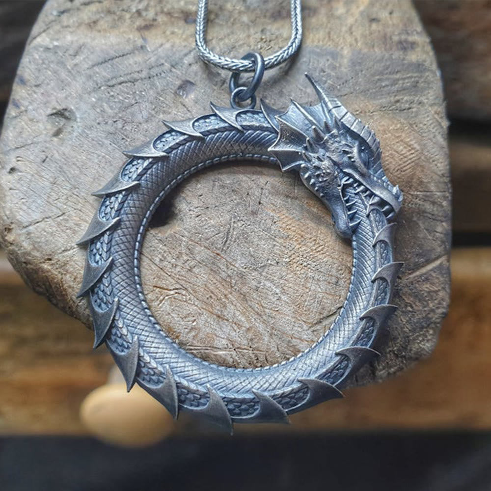 Pure Tin Dragon Snake Necklace - Armored dragon circle on weathered wood, earthy defense symbol