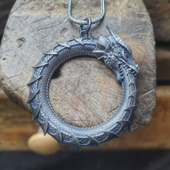 Pure Tin Dragon Snake Necklace - Armored dragon circle on weathered wood, earthy defense symbol