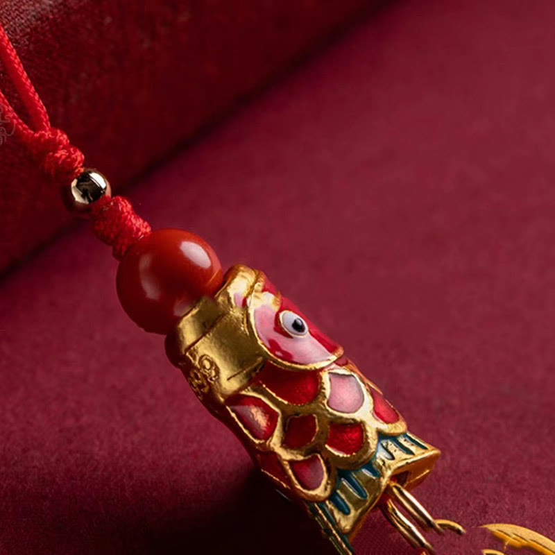 Koi Fish Cinnabar Ruyi Phone Charm – close-up of ruyi head detail on cinnabar pendant, phone charm tassel, luck