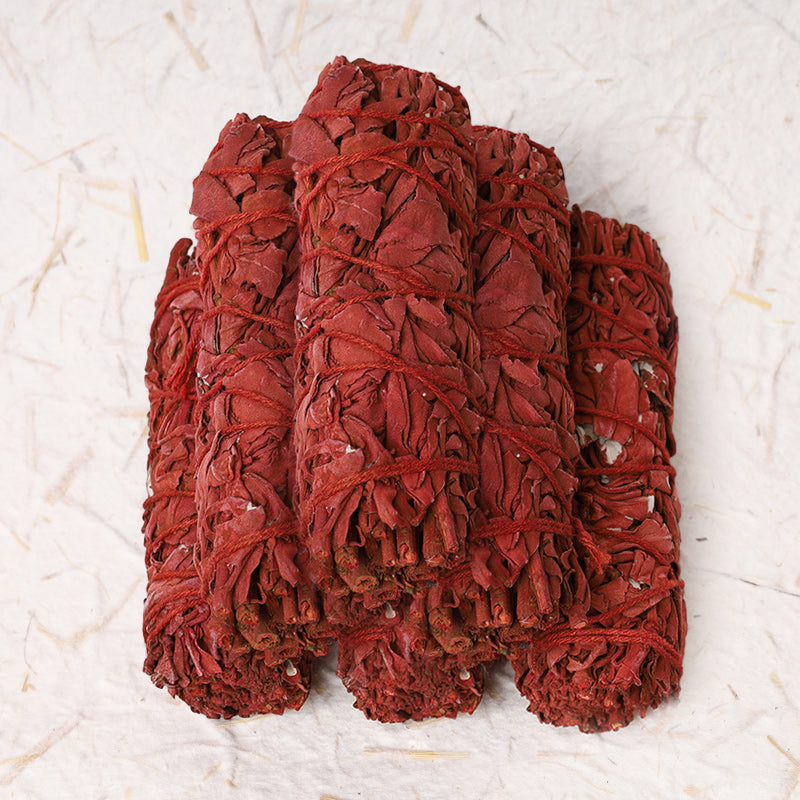 Dragon's Blood sage smudge – four bundled crimson sticks clustered together, healing