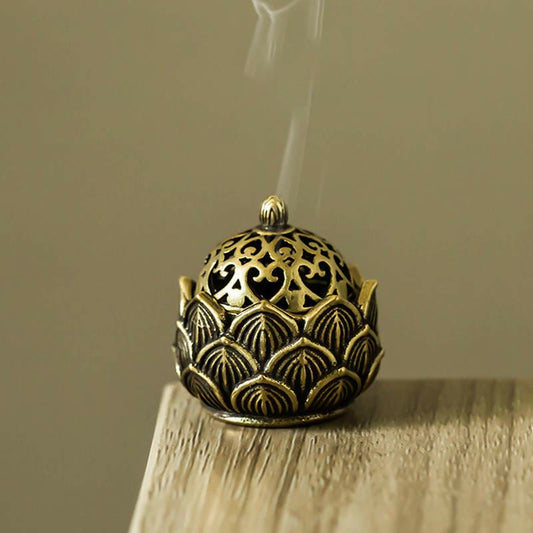 Tibetan Lotus Copper Mini Incense Burner – Smoke rising from openwork dome, brass lotus base