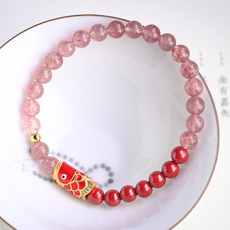 Strawberry Quartz Koi Bracelet – worn on wrist displaying alternating pink and red bead pattern