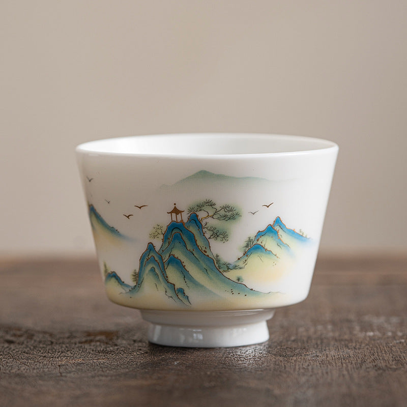 Ceramic Kung Fu Tea Cup – mountain landscape on aged wooden tray with blue peaks and birds, panoramic wrap, heritage