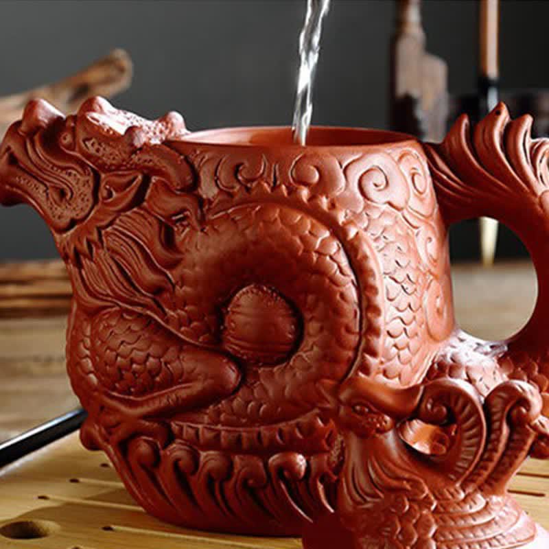 Vintage Dragon Phoenix Purple Clay Teapot – terracotta dragon teapot with water pour on wooden tea tray, warm earthy tones