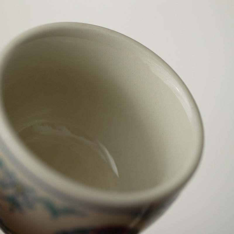 Koi Fish Sunflower Cup – studio lit highlighting vivid arowana painting, teacup