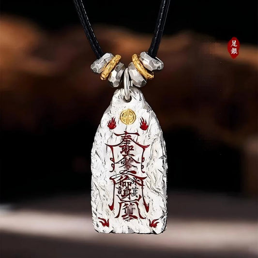 Golden Light Pendant – textured silver talisman with red charms and gold emblem on black cord, protection wealth luck amulet