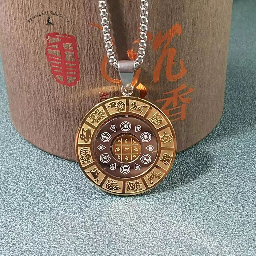 Zodiac Spin Necklace – gold outer ring with twelve zodiac animals, Buddhist mantra center, silver chain, wood pillar backdrop Main image