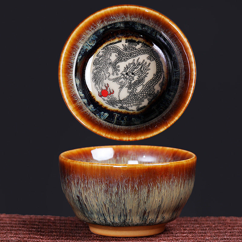 12 Zodiac Jian Zhan Teacup - dragon zodiac dual view showing interior medallion with red pearl and exterior hare fur glaze