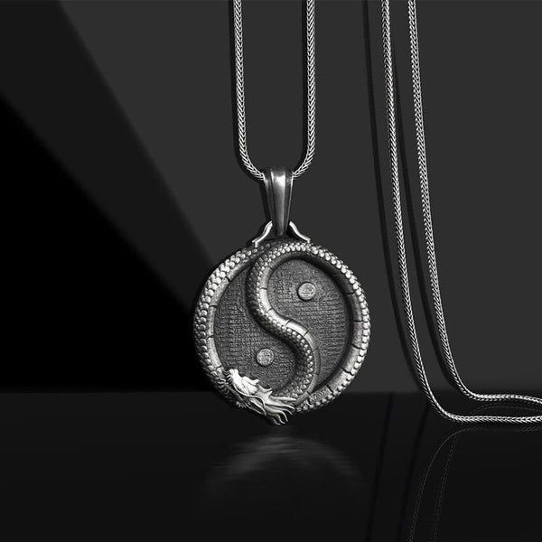 Yin Yang Dragon Pendant – Antiqued silver medallion with sculpted dragon S-curve on black, Spiritual