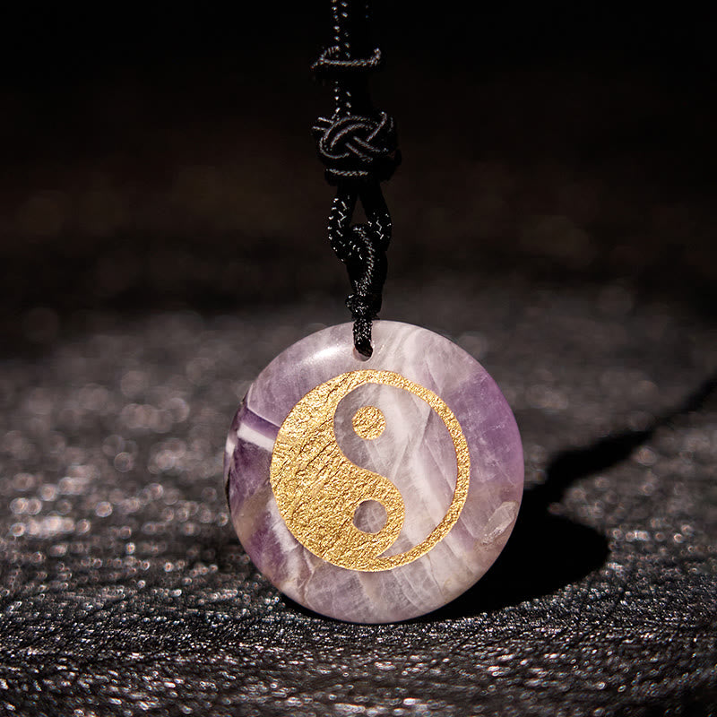Yin Yang Crystal Necklace – Amethyst pendant necklace with gold yin-yang engraving, natural purple and white banded stone on 