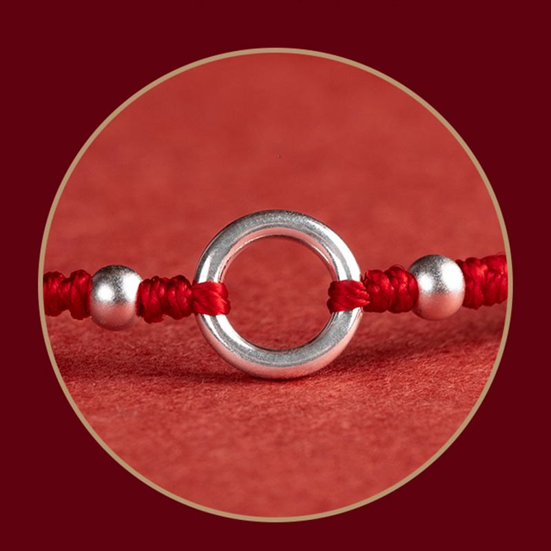 Sterling Silver Lotus Peace Buckle Red String Bracelet – Macro detail of the sterling silver peace buckle ring flanked by two silver beads on red cord with traditional Chinese knotting