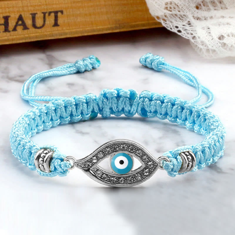 Light blue cord evil eye bracelet with silver evil eye crystal charm, marble lifestyle