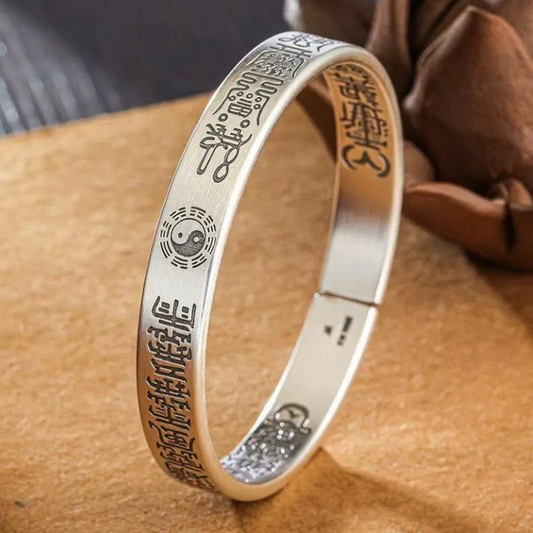Antique Tai Chi Bracelet – upright silver bangle showing Taoist symbols and Tai Chi mark, spiritual jewelry