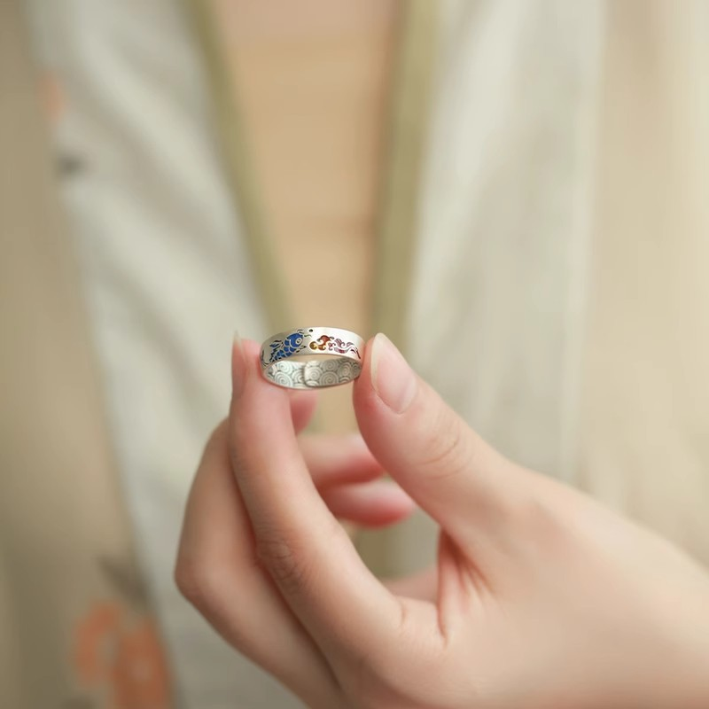 Koi Cloud Ring – Hand holding silver adjustable ring showing blue koi and red cloud enamel details, Chinese style luck