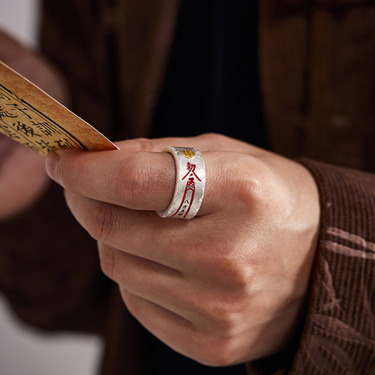 Ba Fang Lai Cai Ring – hand wearing silver band while holding antique scroll book, wealth abundance ring
