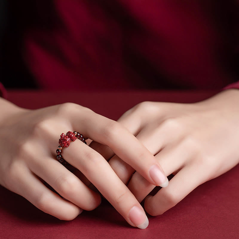 Garnet Cinnabar Ring – model hands cinnabar PiXiu ring both fingers, double protection feng shui