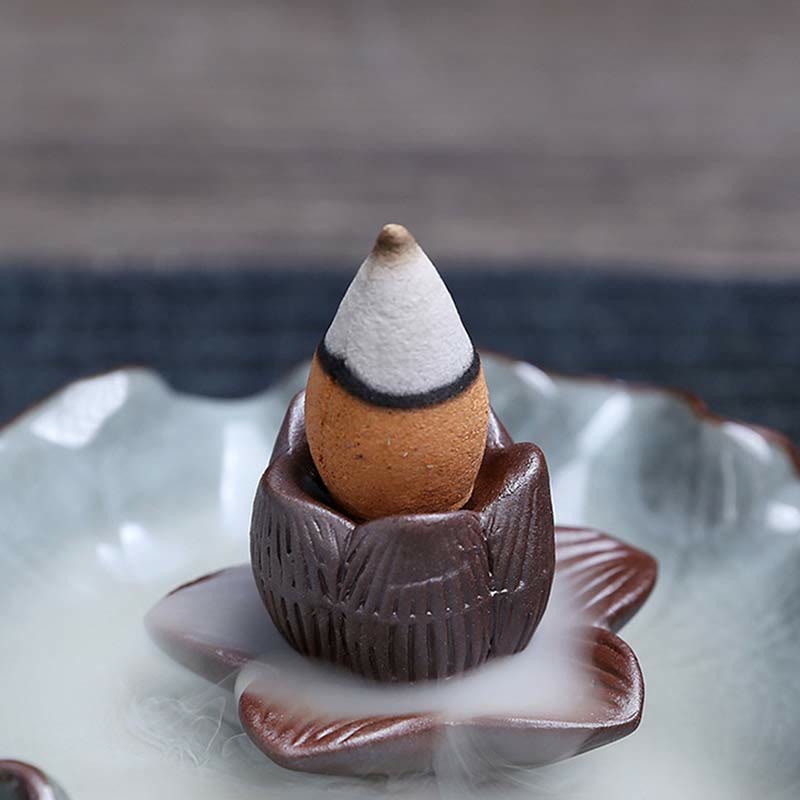 Lotus Ceramic Backflow Incense Burner - close-up backflow cone in brown lotus cup, cascading smoke