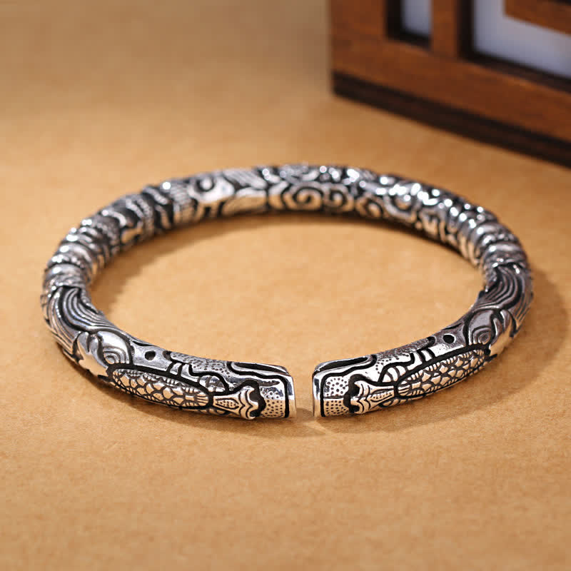 Dragon Head Carved Luck Bangle – elevated view of carved dragon details, Oxidized Finish
