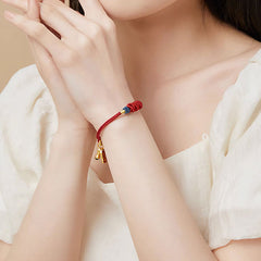 Silver Bracelet – Wrist styling shot of koi braided bracelet, wealth success charm