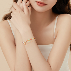 Hetian Jade Bracelet – Model wearing on wrist with white top, gold chain jade bead koi bracelet, elegant luck charm