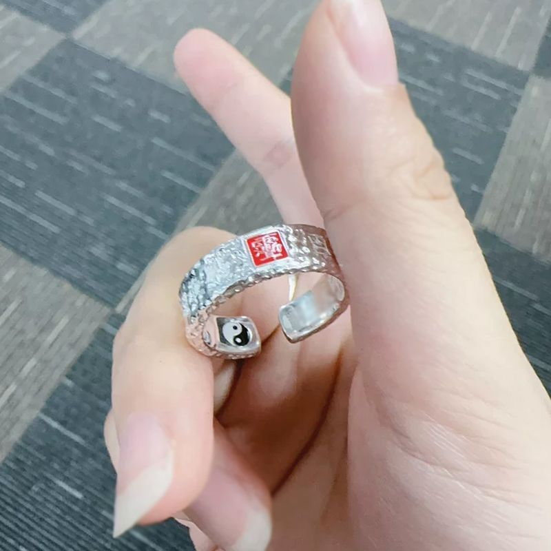 Tian Guan Ci Fu Ring – silver ring on finger with indoor carpet background, blessing protection amulet ring