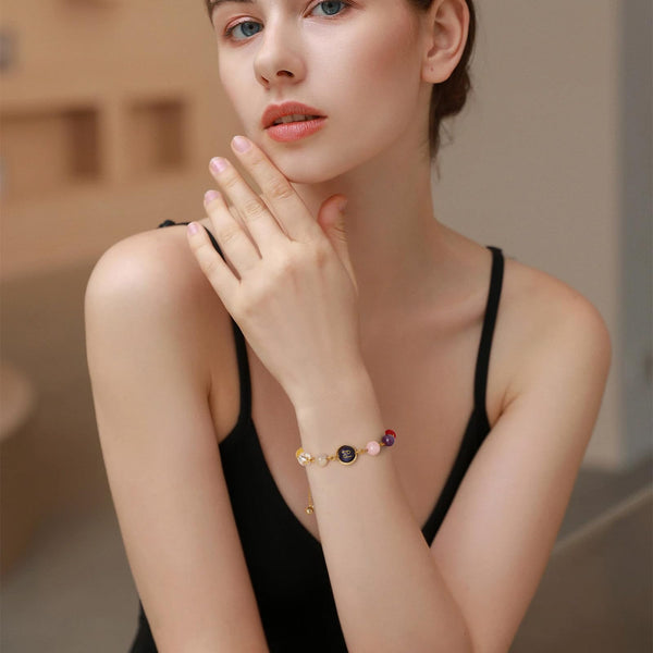 18K Gold Plated Zodiac Stone Bracelet – Virgo on woman's wrist, lifestyle shot with colorful gemstone beads
