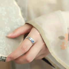 Koi Cloud Ring – Worn on finger with light fabric sleeve, blue enamel koi and cloud silver ring, adjustable unisex flow