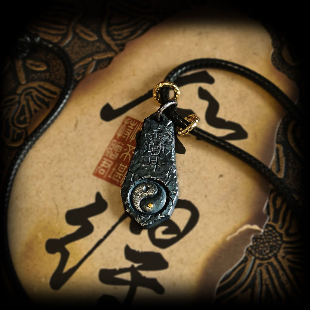 Tai Chi Big Dipper Necklace – black pendant with engraved Tai Chi and gold loop on leather cord, cosmic harmony necklace