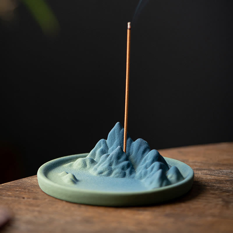 Ceramic Backflow Incense Burner – Mountain landscape with single stick incense on dark wood, minimalist zen decor