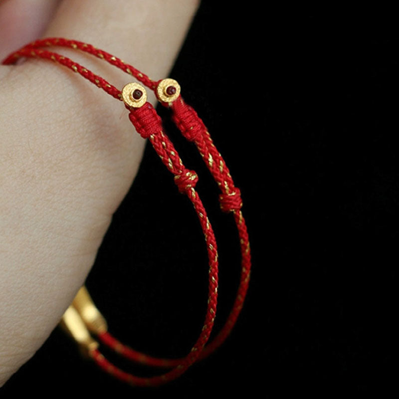 14K Gold Plated Koi Braided Bracelet – flat lay on white background, gold koi on red cord with adjustable knot