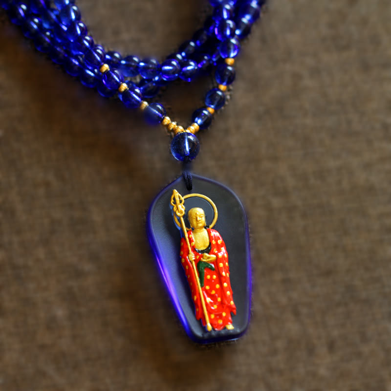 Ksitigarbha Buddha Liuli Crystal Necklace – Rich caramel liuli crystal orb with inner Buddha carving, devotional art
