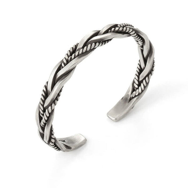 Viking twisted braided bracelet on white background with double-strand braid rope-textured inlay and oxidized antique silver finish showing open cuff terminals