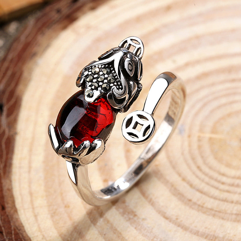 Feng Shui Garnet Pixiu Ring – top view silver adjustable ring with red garnet pixiu and ancient coin on wood slice