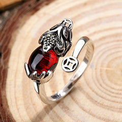 Feng Shui Garnet Pixiu Ring – top view silver adjustable ring with red garnet pixiu and ancient coin on wood slice
