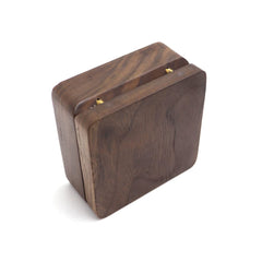 Natural Walnut Necklace Box – closed three-quarter view showing wood grain and rounded corners, polished
