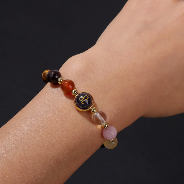 Zodiac Crystal Bracelet – close-up of Leo beads on wrist with gold zodiac charm detail