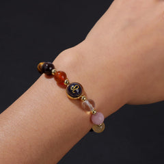 Zodiac Crystal Bracelet – close-up of Leo beads on wrist with gold zodiac charm detail