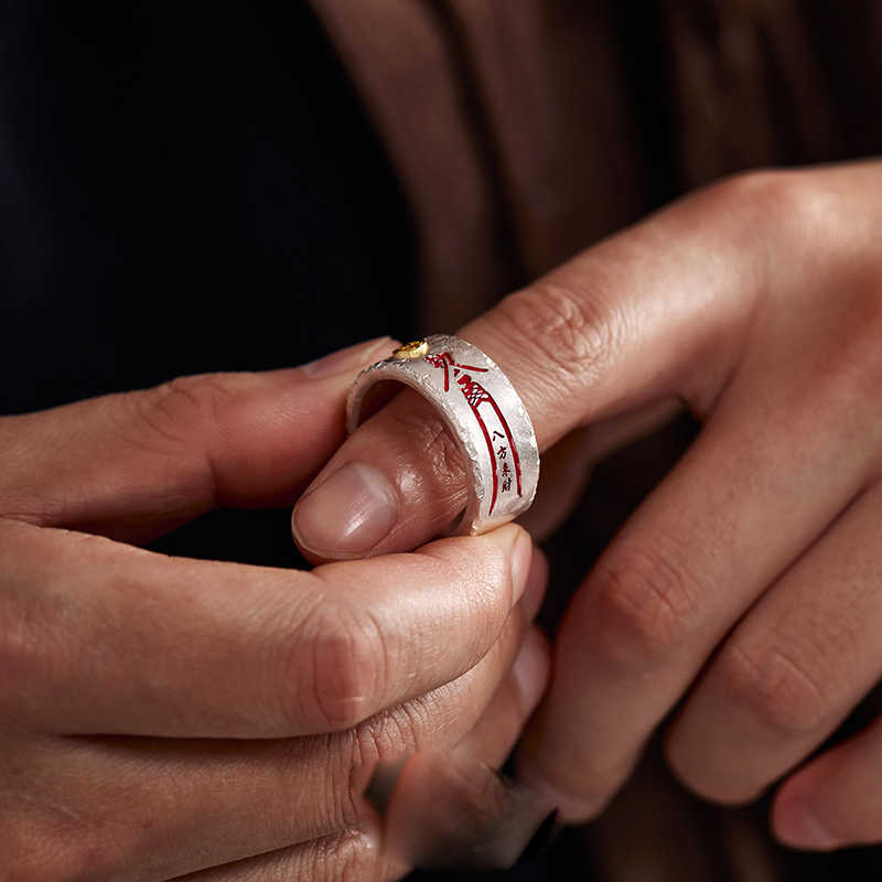 Ba Fang Lai Cai Ring – close-up of hands adjusting silver open ring on finger, wealth abundance ring