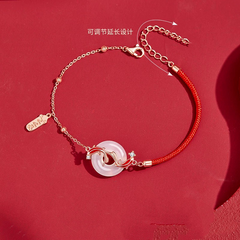 Koi Bracelet – Flat lay on red showing adjustable extender chain with Chinese text, jade crystal luck bracelet