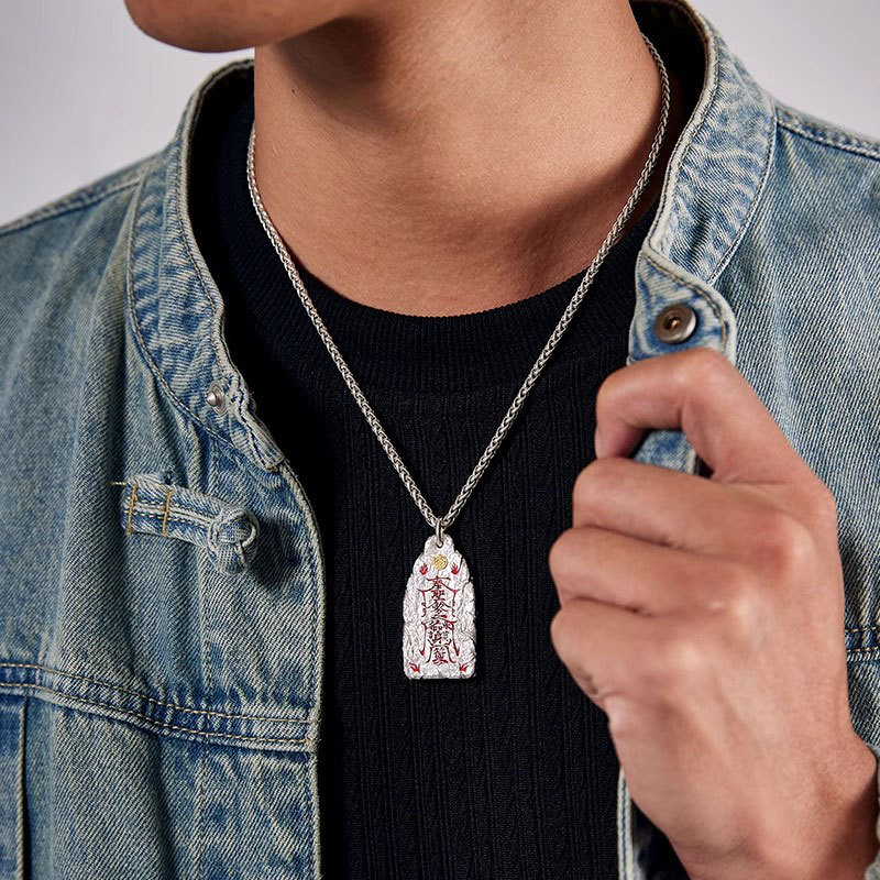 Golden Light Pendant – man wearing silver chain pendant with denim jacket, protection wealth luck amulet