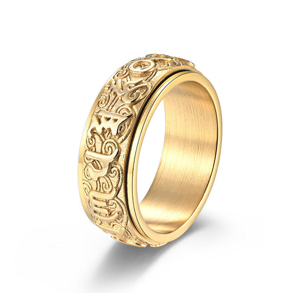 Om Mani Padme Hum Ring – Gold-tone spinner ring on white, carved Tibetan symbols on titanium steel
