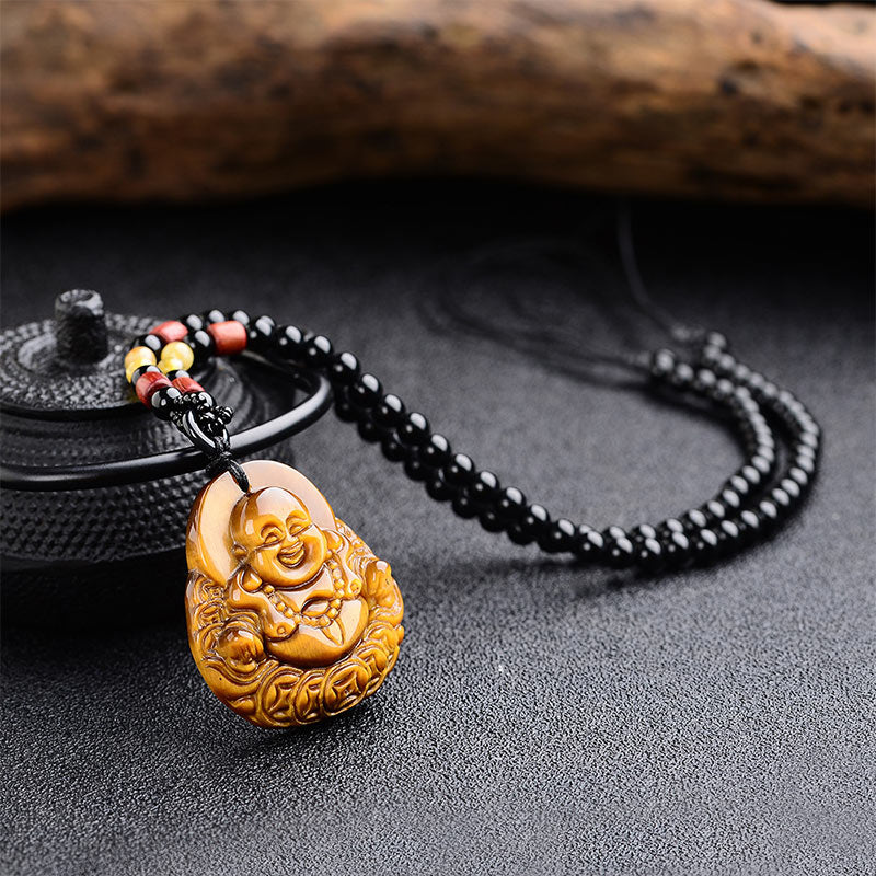 Natural Stone Buddha Success Bracelet – tiger eye pendant on beaded cord, dark gray surface, iron teapot, artisan jewelry pho
