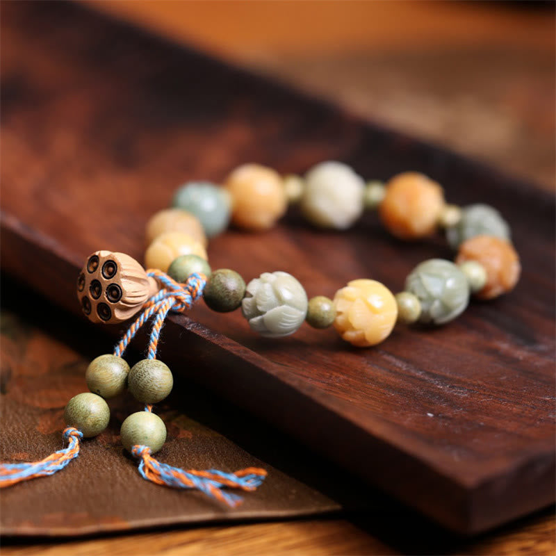 Bodhi Seed Green Sandalwood Lotus Bracelet – carved lotus beads on dark wood with pod tassel, Mindful