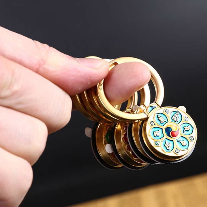 Om Mani Padme Hum Phone Ring Holder – Gold keychain with turquoise enamel mantra medallion, Buddhist wheel