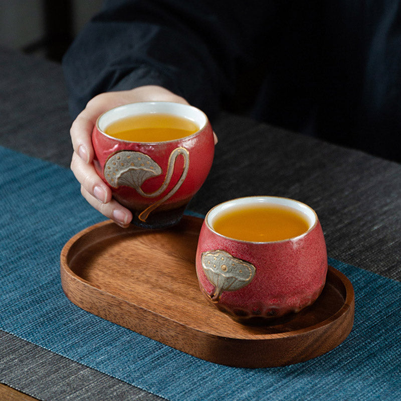 Lotus Pod Ceramic Kung Fu Tea Cup - Red pair on wooden tray with tea served, sharing moment