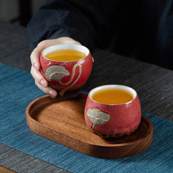 Lotus Pod Ceramic Kung Fu Tea Cup - Red pair on wooden tray with tea served, sharing moment