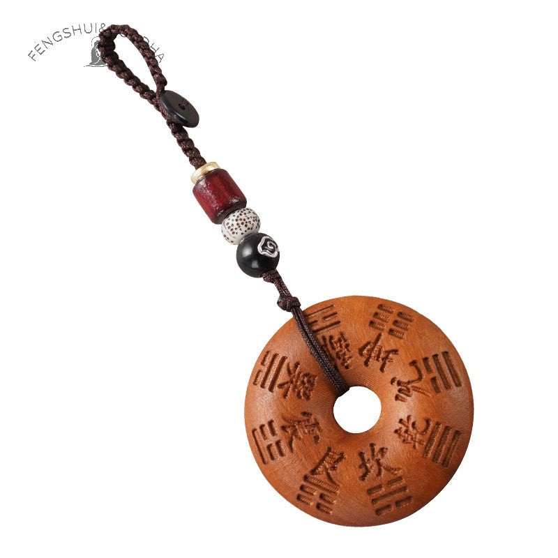 Peach Wood Bagua Coin – single coin white background, Bagua trigrams face, brown braided cord decorative beads, Taoist pendant