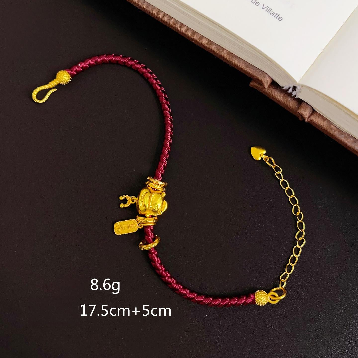 Ben Ming Nian Bracelet – flat lay on black surface with size text, gold clasp chain, product detail